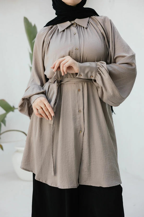 Beige raglan crunched silk blouse with belt .