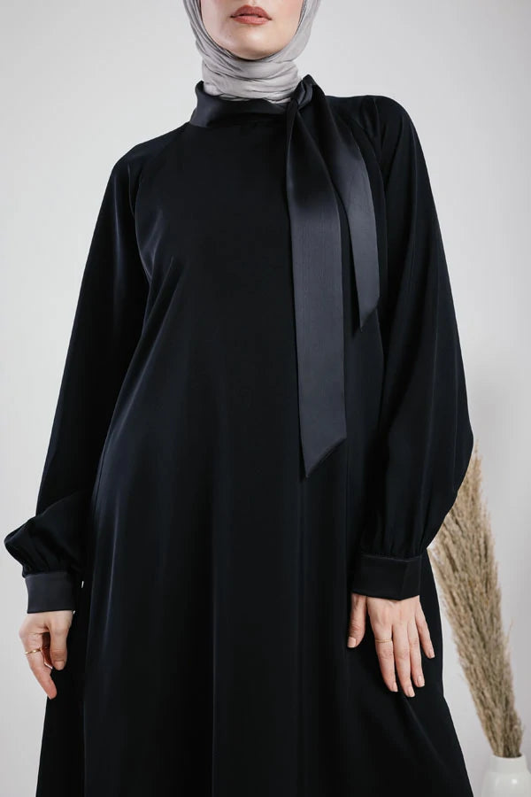 silky abaya with satin ribbon on the neck.