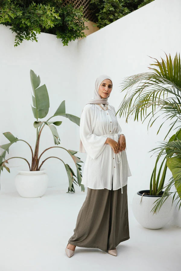 White raglan crunched silk blouse with belt .