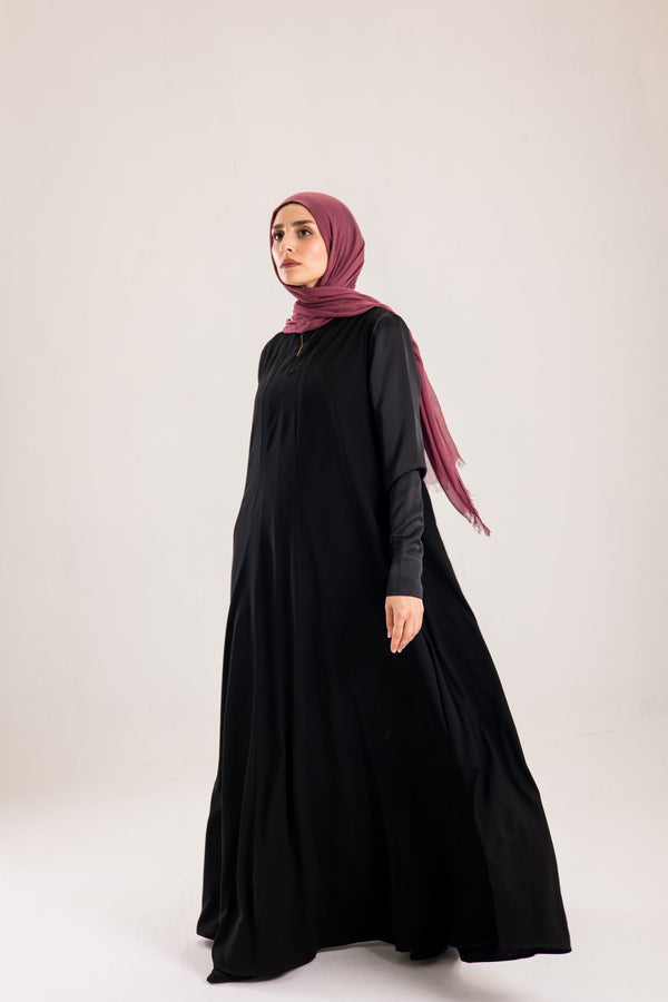 Sun rays crepe abaya with satin sleeves.