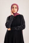 Sun rays crepe abaya with satin sleeves.
