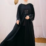 Cloche silk abaya with satin belts on sleeves and chest.