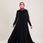 Sun rays crepe abaya with satin sleeves.